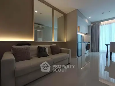 Modern living room with sleek kitchen and cozy sofa in stylish apartment