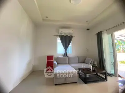 Modern living room with cozy sectional sofa and air conditioning