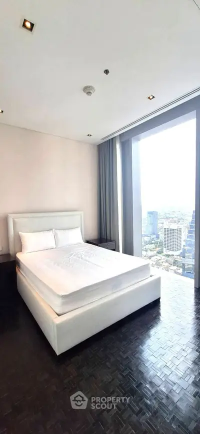 Luxurious bedroom with stunning city view and modern decor