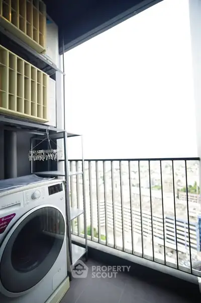 Modern balcony with washing machine and city view, perfect for urban living.