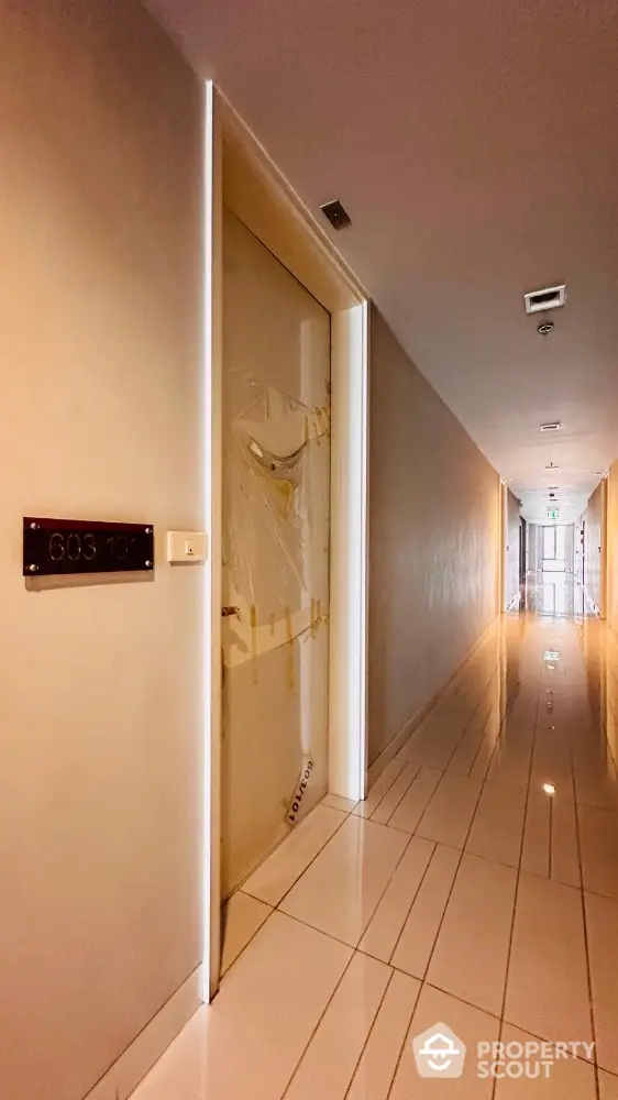 Modern apartment hallway with sleek design and polished flooring