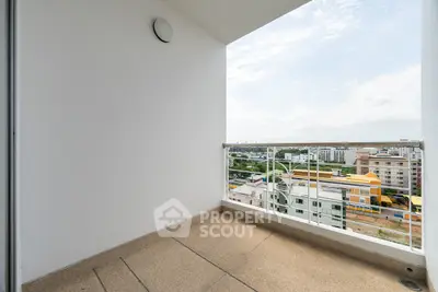 Spacious balcony with stunning city view in modern apartment