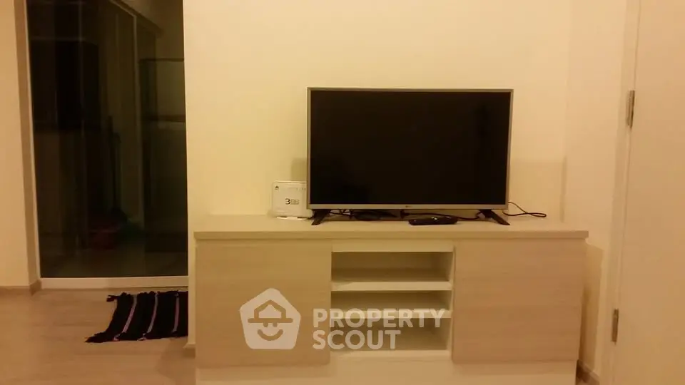 Modern living room with sleek TV stand and flat-screen TV, perfect for cozy entertainment nights.