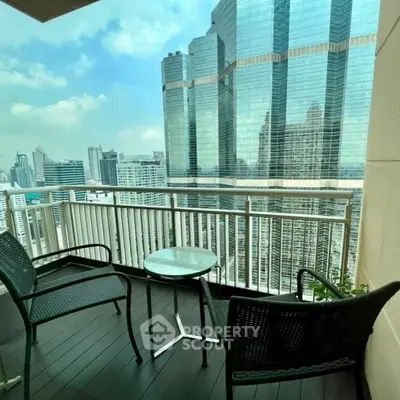 Stunning city view from a modern balcony with sleek furniture, perfect for urban living.