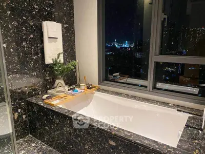 Luxurious bathroom with city view and elegant bathtub