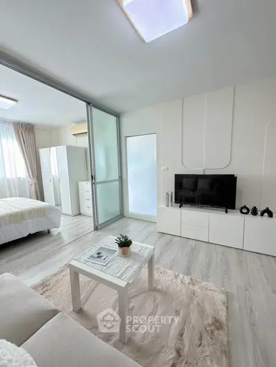 Modern studio apartment with sleek design and cozy living area