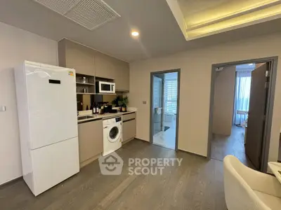 Modern kitchen with appliances and open layout in stylish apartment