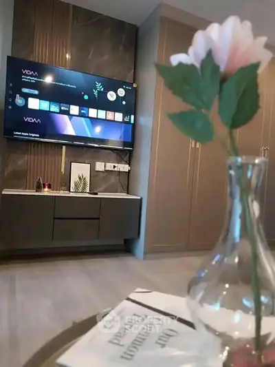 Modern living room with wall-mounted TV and elegant decor