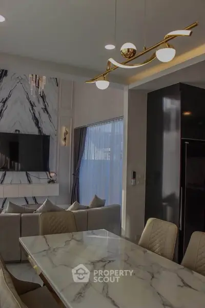 Luxurious modern living room with marble accents and elegant lighting