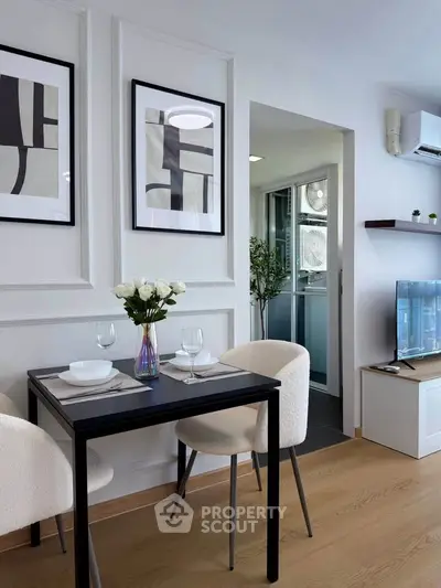 Chic dining area with modern decor and cozy seating in a stylish apartment