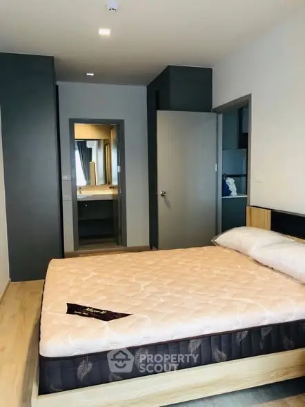 Modern bedroom with stylish decor and comfortable bed in a contemporary apartment.