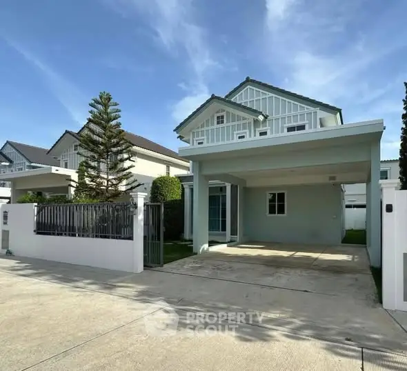 Charming two-story house with spacious driveway and modern design
