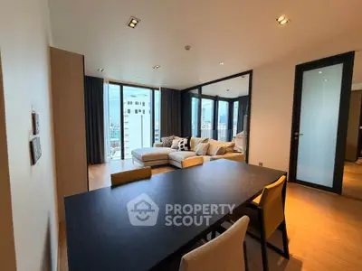 Spacious modern living room with city view and elegant dining area