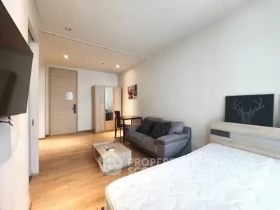 Modern studio apartment with cozy living area and stylish decor