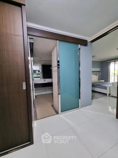 Modern interior with sleek bathroom and spacious bedroom in luxury apartment