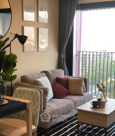 Cozy living room with stylish decor and large window view