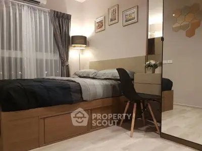 Cozy modern bedroom with stylish decor and large window