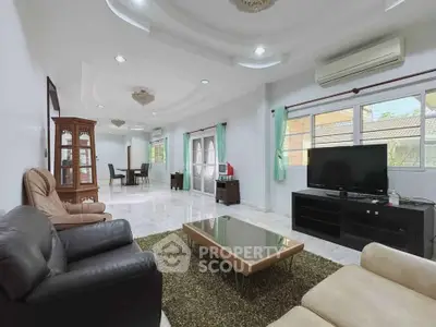 Spacious living room with modern furniture and large windows in a stylish home