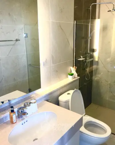 Modern bathroom with sleek fixtures and elegant marble tiles