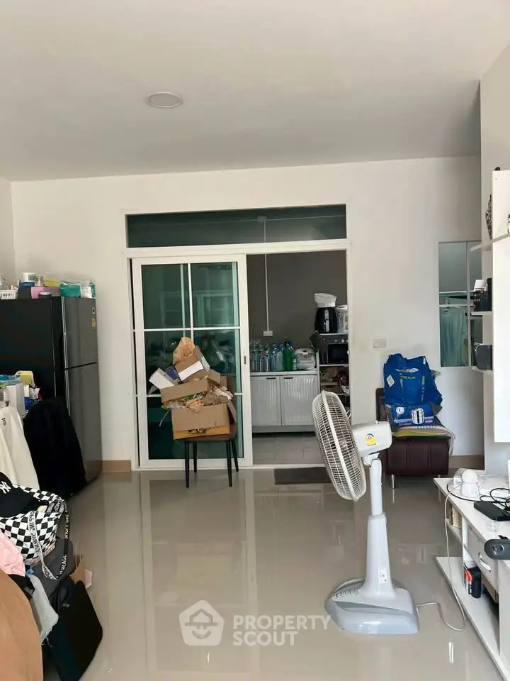 Spacious living area with modern appliances and sleek design, perfect for comfortable urban living.