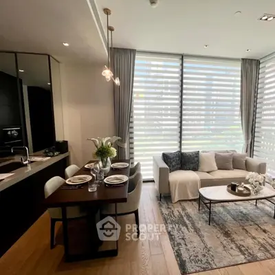 Modern living room with dining area and large windows in a stylish apartment