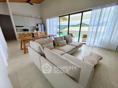 Spacious modern living room with open kitchen and stunning view