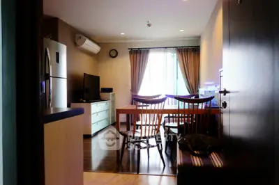 Cozy living room with modern furniture and natural light, perfect for relaxation and entertainment.