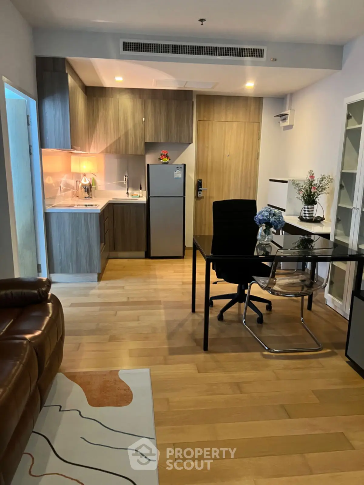 Modern apartment interior with open kitchen and stylish dining area