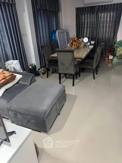 Elegant dining area with plush seating and modern decor in a stylish home interior.