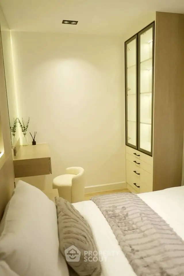 Elegant bedroom with modern decor and built-in storage