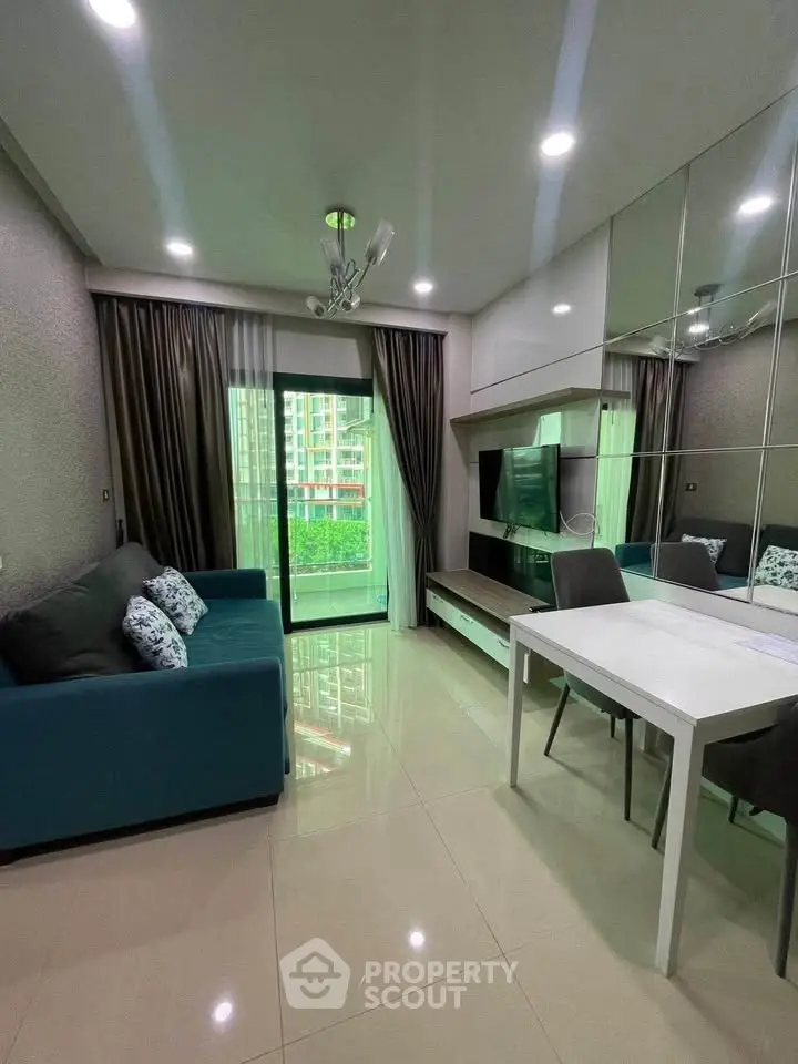 Modern living room with sleek furniture and balcony view