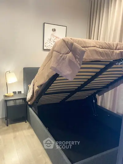 Modern bedroom with storage bed and elegant decor