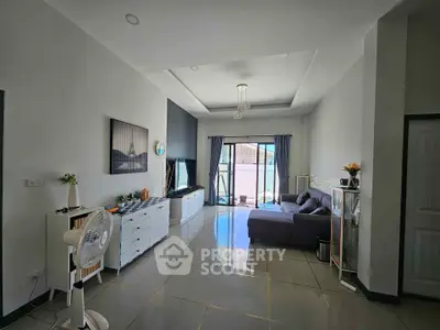 Spacious modern living room with sleek tile flooring and stylish decor