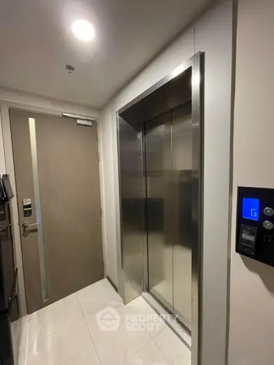 Modern apartment elevator with sleek design and secure access door.