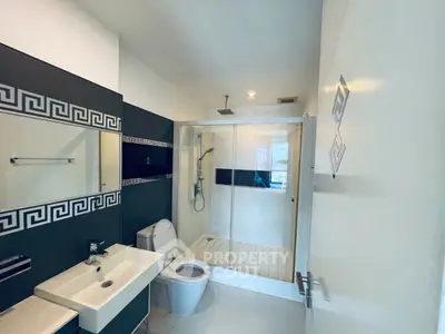 Modern bathroom with sleek design and spacious shower area