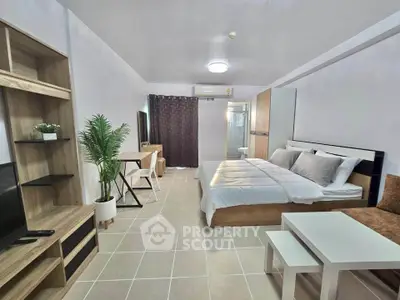 Modern studio apartment with stylish furniture and cozy ambiance