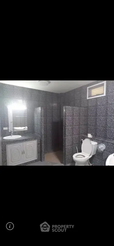 Modern bathroom with stylish patterned tiles and sleek fixtures