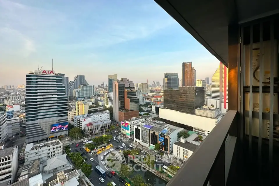 Stunning cityscape view from high-rise balcony overlooking vibrant urban skyline.
