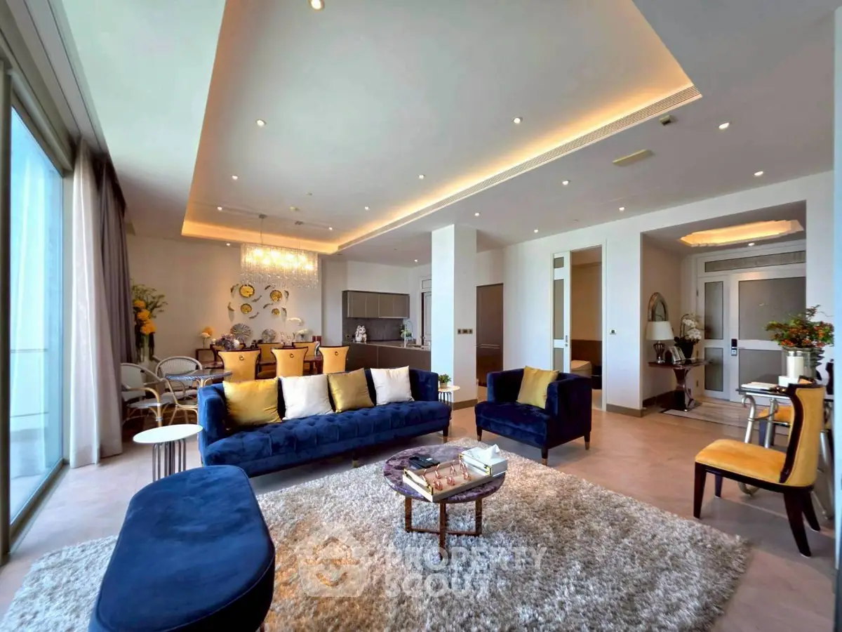 Luxurious modern living room with elegant decor and open layout, featuring plush seating and ambient lighting.