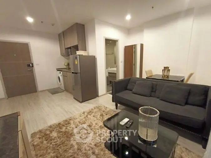 Modern living room with cozy sofa and stylish decor in open layout apartment