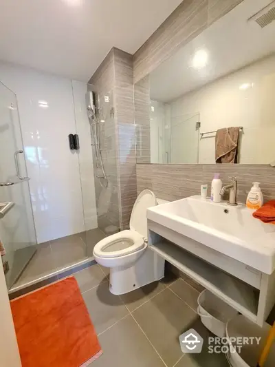 Modern bathroom with glass shower and sleek fixtures