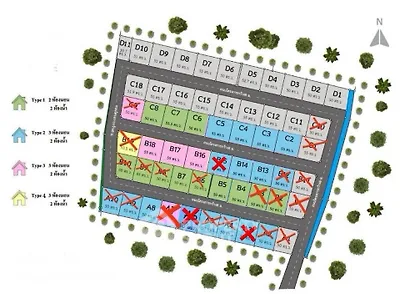 Colorful real estate plot map with various lot sizes and types, surrounded by greenery.