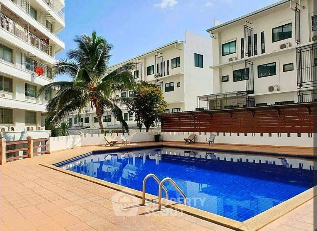 Stunning apartment complex with a refreshing pool and modern architecture.