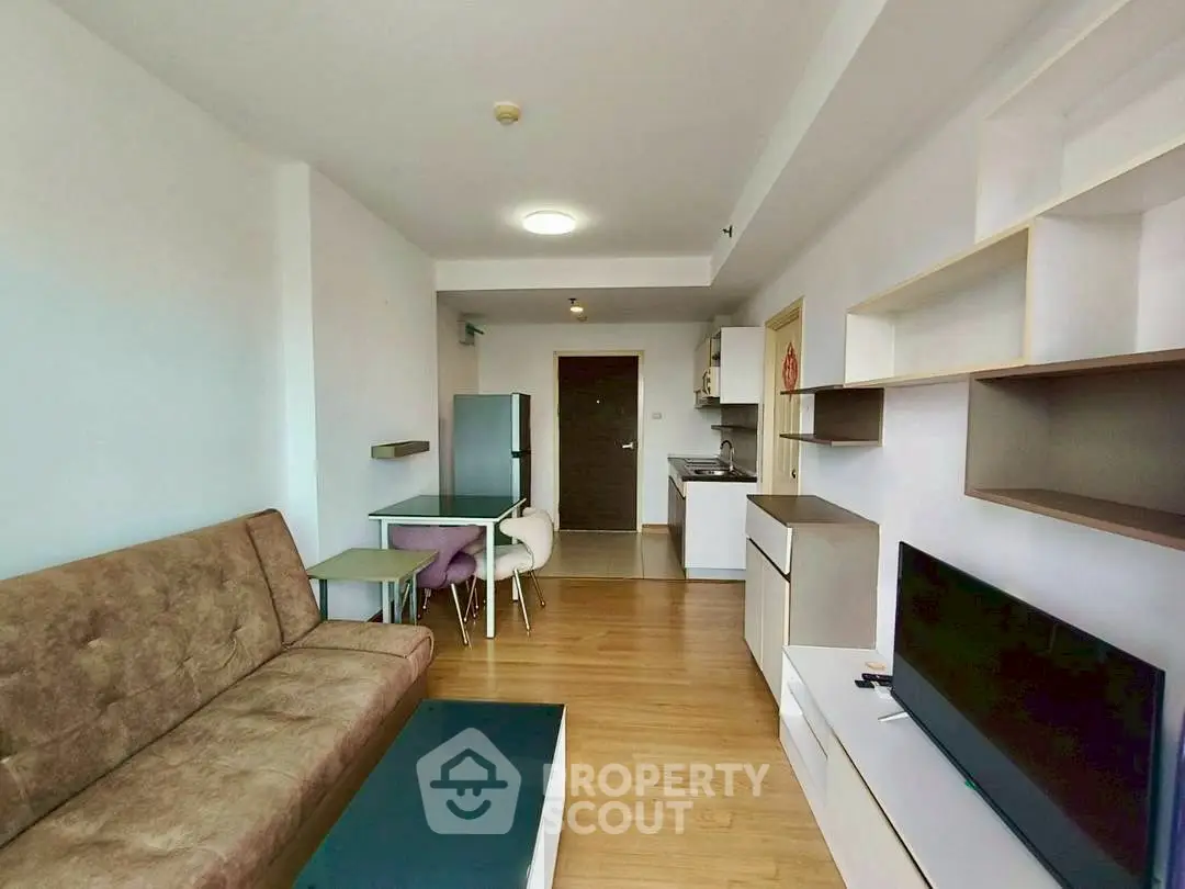 Modern living room with stylish furniture and open kitchen layout