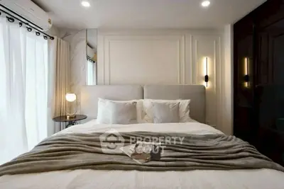 Luxurious bedroom with modern lighting and elegant decor