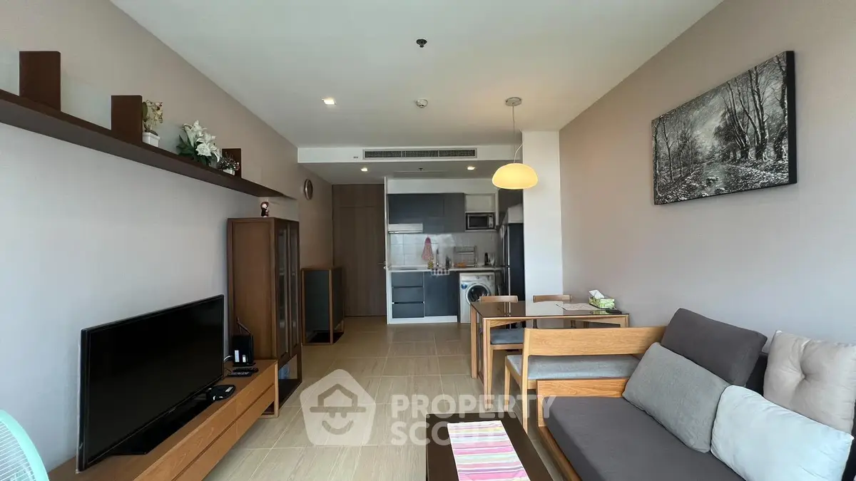 Modern living room with open kitchen in stylish apartment