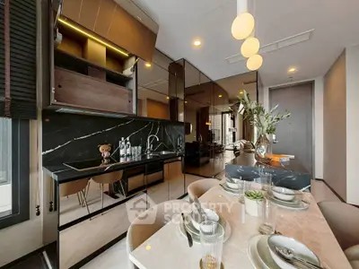Luxurious modern kitchen and dining area with sleek black marble and elegant decor.
