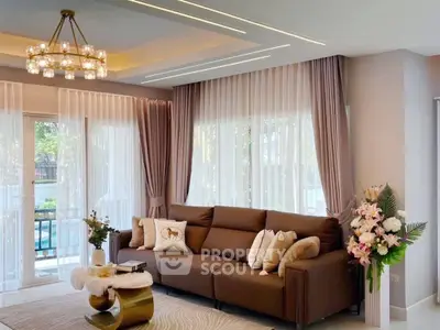 Luxurious living room with elegant decor and large windows for natural light.