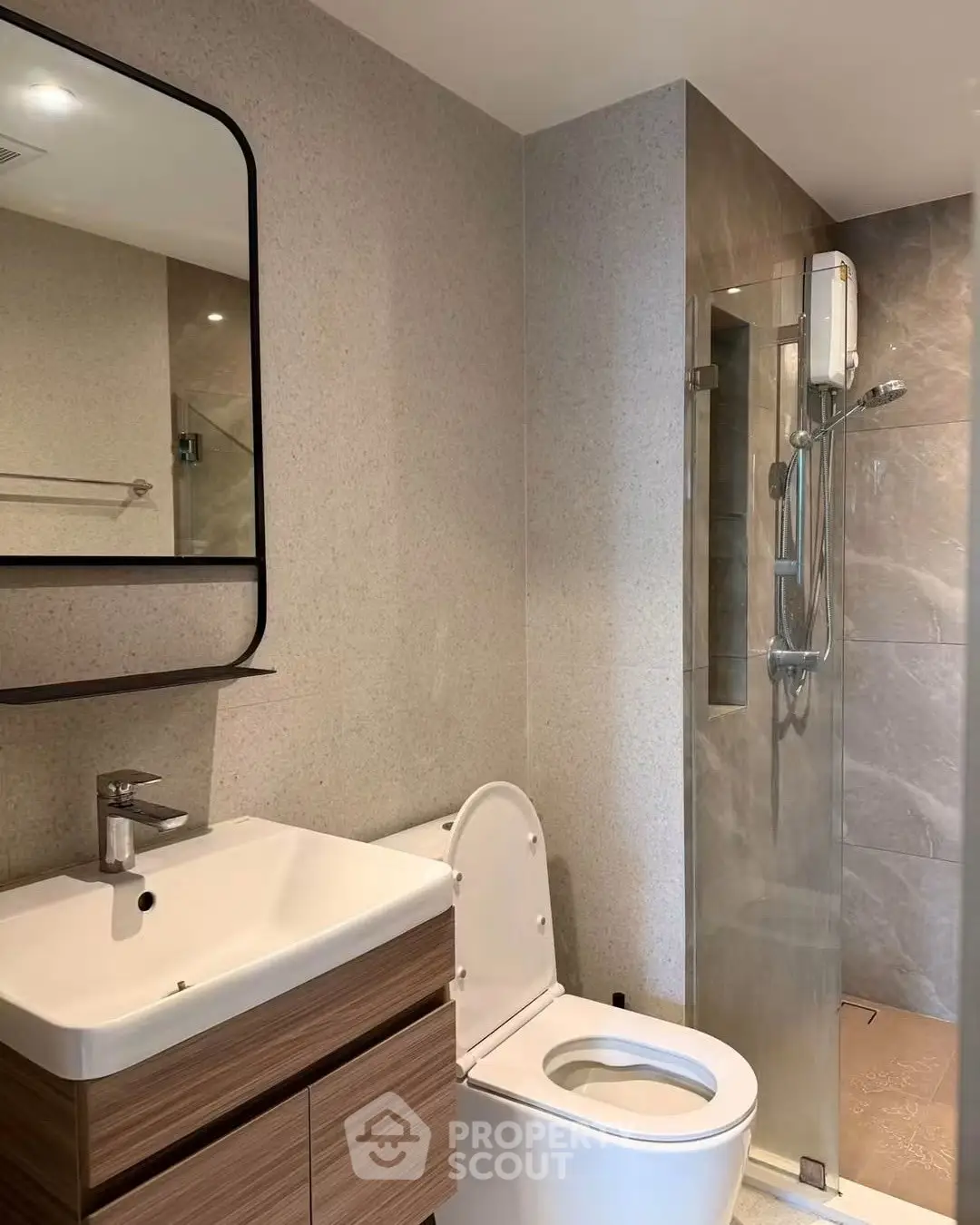 Modern bathroom with sleek fixtures and glass shower enclosure