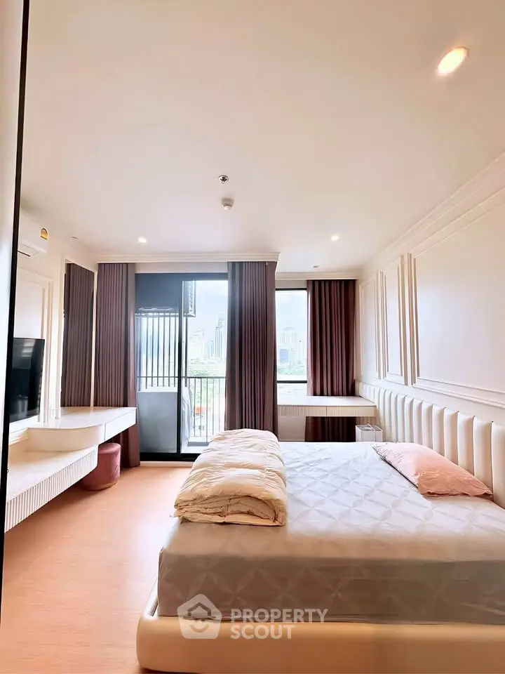 Spacious modern bedroom with city view and elegant decor